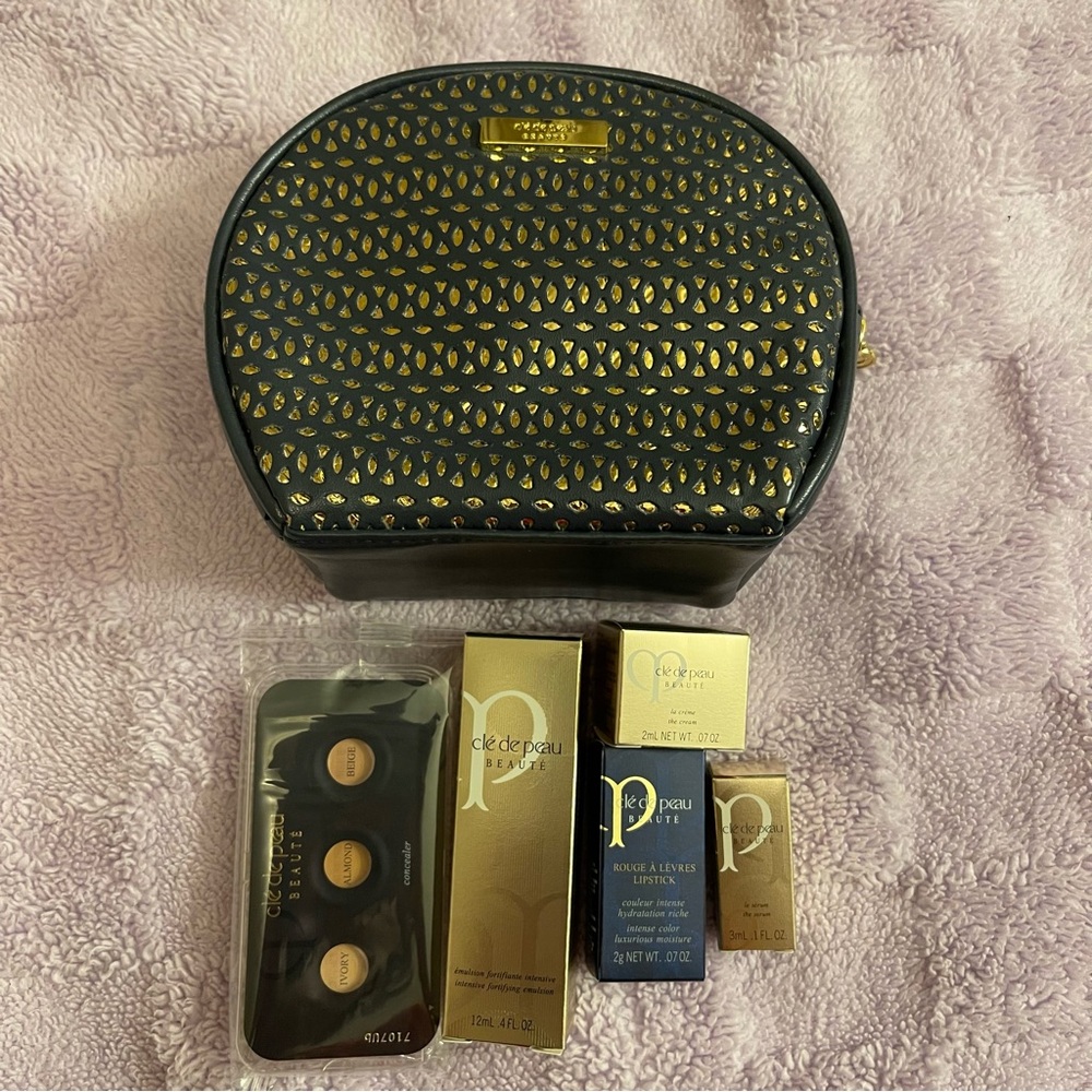 Cle de Peau Black and Gold Cosmetic Bag with Products